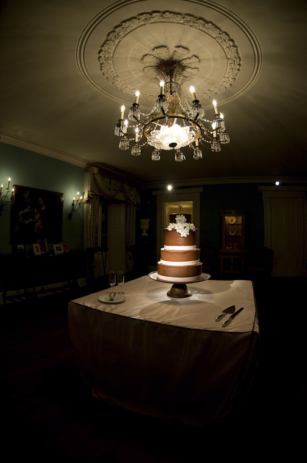 wedding cake underneath chandelier - wedding photo by top South Carolina wedding photographer Leigh Webber